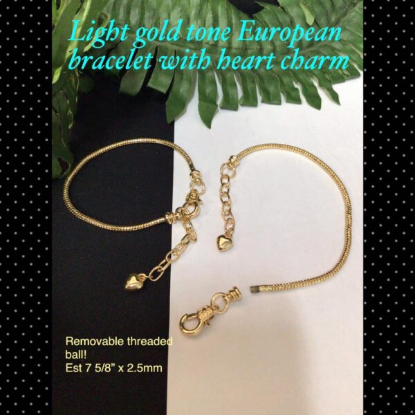 Light gold tone European bracelet with heart charm