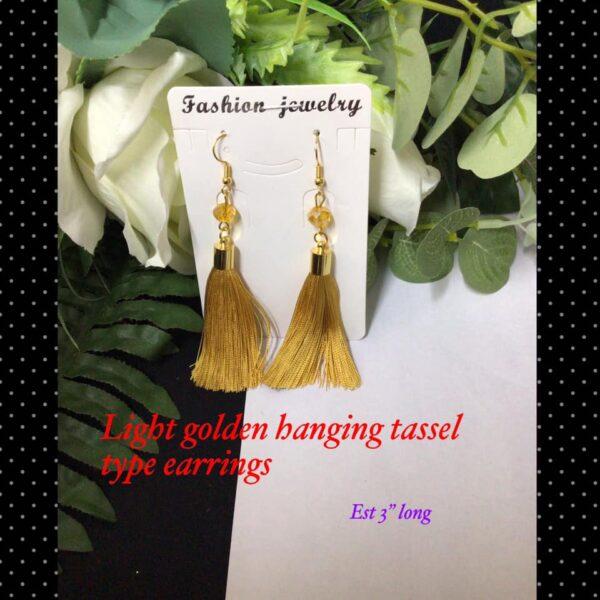 Light golden hanging tassel type earrings