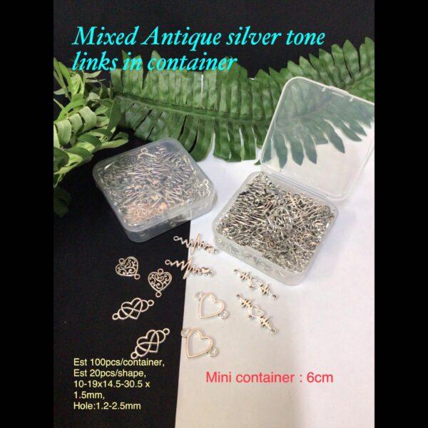 Mixed Antique silver tone links in container (est 100pcs)